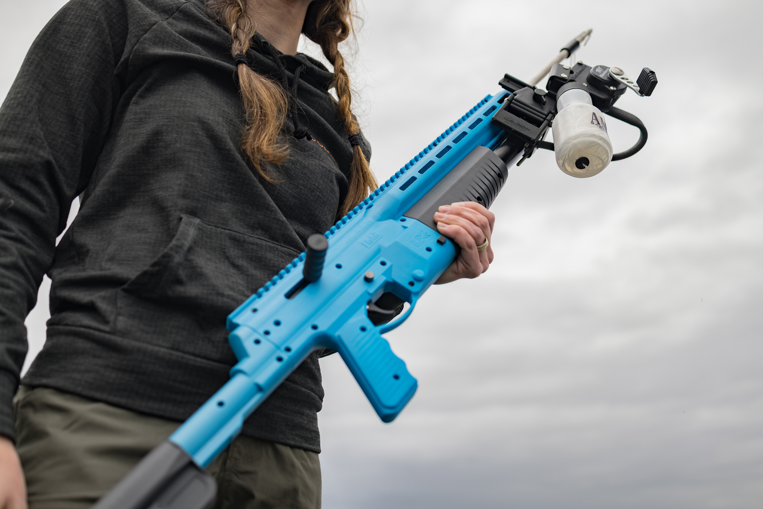 Abby Casey holding the Umarex FishR